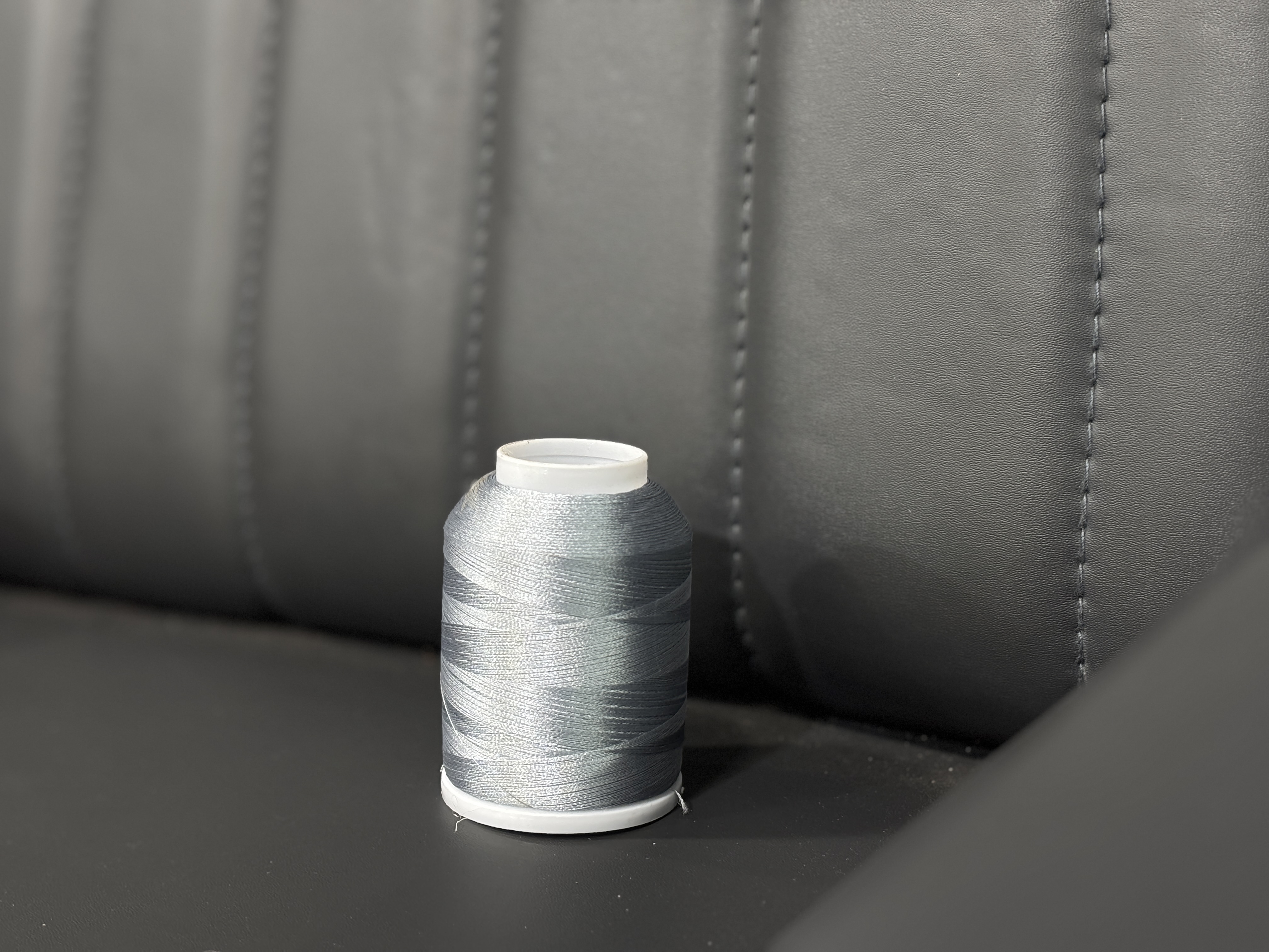 Sofa upholstery stitching with thread cone